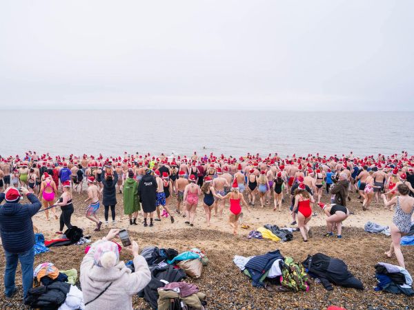 Boxing Day Swim people running into the sea
