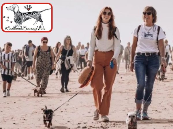 Southold Sausage dog walk logo on photo of walkers with dogs